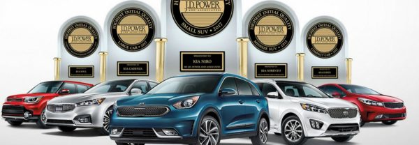 5 Kia models in front of trophies featured in a blog post about Jack Daniels Kia